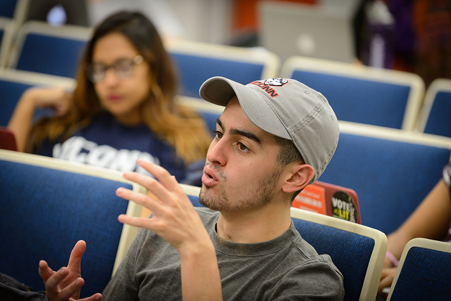 A student engages in a conversation in class.
