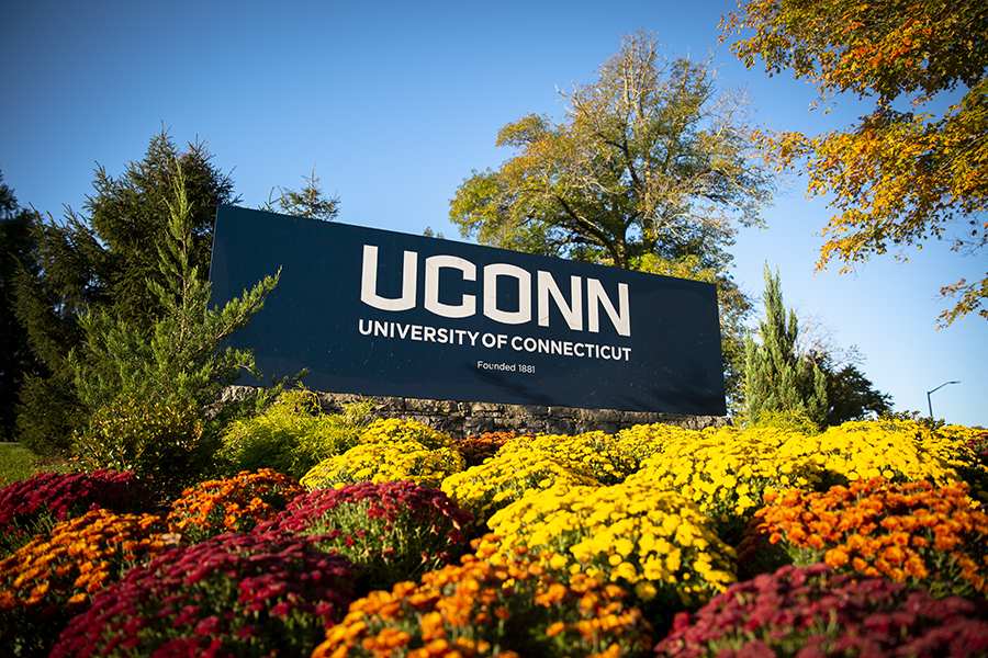 The UConn sign on a sunny fall day.
