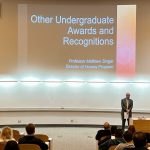 Prof. Matt Singer stands with Prof. Yalof while introducing other Undergraduate Awards and Recognitions.